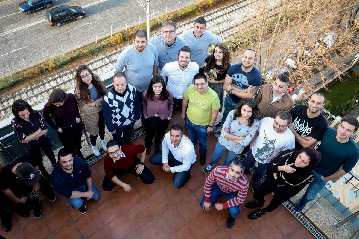 Екипът на Atom Solutions на терасата на офиса в София